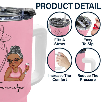 Personalized pink 40oz tumbler with floral design and custom name, featuring easy-to-use straw and lid. Ideal gift.